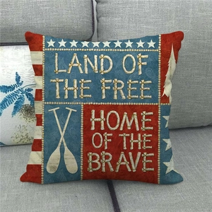 Close-up of vintage American flag linen pillow cover with embroidered stars and nautical oars