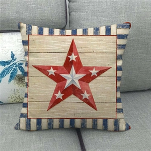 Detail of linen pillowcase with red star on faux wood texture and blue stripes