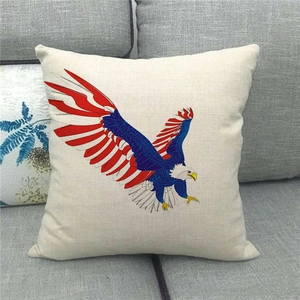Close-up of bald eagle American flag print on linen pillowcase placed on a sofa