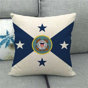 Detail of US Coast Guard emblem on linen pillow case with cross flag design