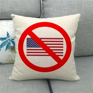 Detailed close-up of textured linen pillowcase with American flag graphic on a sofa