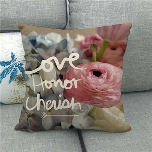 Detailed texture of linen throw pillow cover with Love Honor Cherish floral print