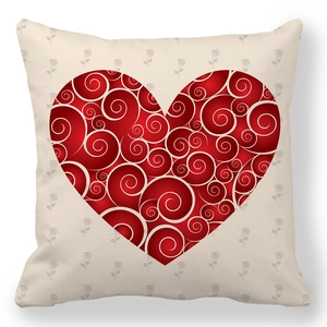 Close-up of red heart pillowcase with white scroll patterns and subtle rose details
