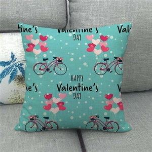 Detail of turquoise linen pillow case with vintage bicycle and Valentine's Day balloons