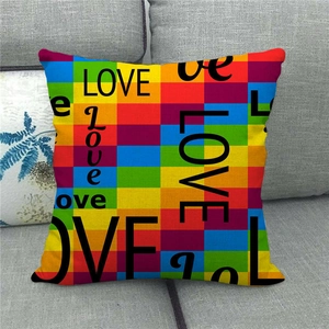 Rainbow LOVE linen pillow cover on a grey sofa, perfect for Valentine's Day decor
