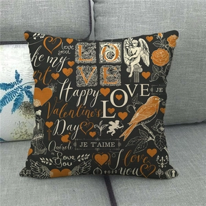 Close-up of Valentine's linen pillowcase with Love and Heart prints on a sofa