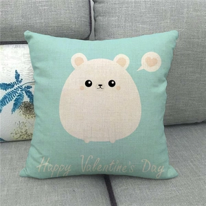 Detail of mint green linen pillow case featuring a white bear and Valentine's Day text