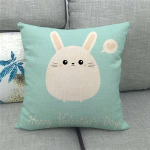 Close-up of mint green linen pillow case with rabbit and Happy Valentine's Day print
