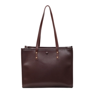 Large dark brown vintage tote bag in matte leather with gold rivets and magnetic buckle