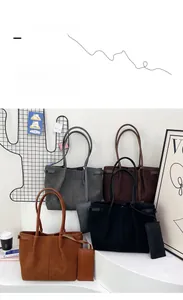Detailed view of matte tote bag set featuring main bag and matching small pouch in four colors