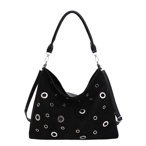 Black matte hobo tote bag for women featuring silver metal grommets and shoulder strap