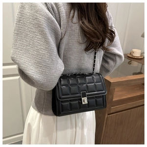 Detailed back view of a black quilted leather square shoulder bag with metal chain strap