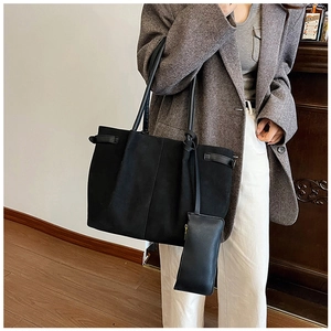 Detail of black matte suede tote bag set with matching pouch and long shoulder straps