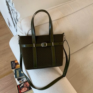Olive green vintage suede tote bag with leather handles and metallic buckle for women