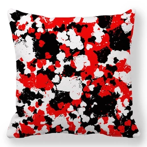 Macro shot of square peach skin pillowcase with red black and white abstract splash pattern