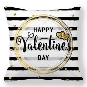 Close-up of Valentine's pillowcase with gold hearts and Happy Valentine's Day text