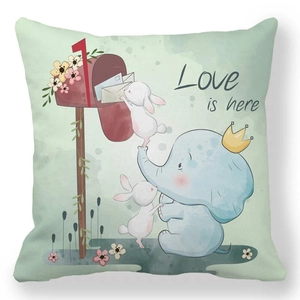 Detailed macro view of mint green peach skin fabric cushion cover with love is here print