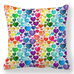 Peach skin pillowcase featuring colorful watercolor heart patterns on a white background