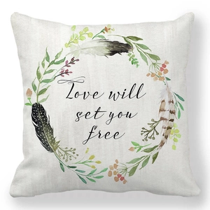 Detail of peach skin pillowcase with Love will set you free text and floral wreath