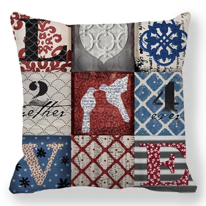 Detail view of the vintage patchwork Love pillow cover featuring heart and bird patterns