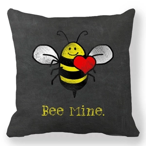 Close-up of peach skin pillowcase with Bee Mine text and heart-holding bee print