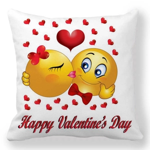 Detail of Happy Valentine's Day throw pillow with cartoon emoji and red hearts