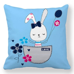 Detail of blue peach skin pillowcase with cartoon rabbit, love tag and floral pattern
