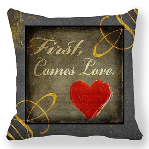Detail of First Comes Love peach skin pillowcase with red heart and gold swirls