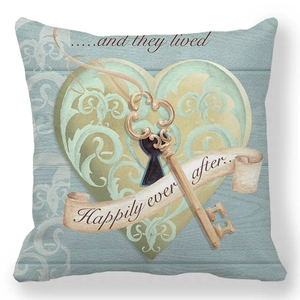 Detail of peach skin pillowcase with vintage heart, key, and 'Happily ever after' text