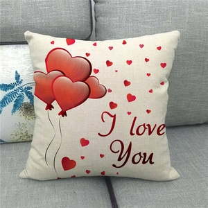 Close-up of linen Valentine's pillowcase with red heart balloon and I Love You text