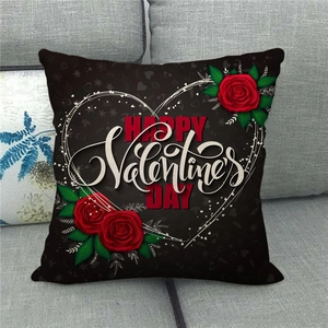 Detail of Happy Valentine's Day linen pillowcase with red roses on black fabric