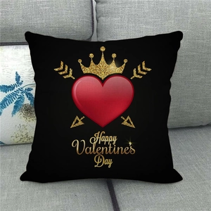 Macro shot of Valentine's linen pillowcase with heart and crown on a sofa