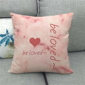 Linen pillowcase featuring pink marble texture and red heart with 'be loved' text