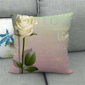 Detailed texture of a linen pillowcase featuring a white rose and LOVE pattern print