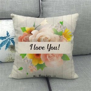 Close-up of linen cushion cover with floral print and customizable name placeholder