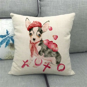 Detail view of linen pillowcase featuring a chihuahua print with XOXO text on grey sofa