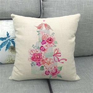 Detailed texture of linen throw pillow cover featuring pink birds and rose floral print