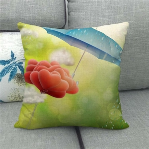 Detail of linen pillowcase featuring a creative red heart balloon and blue umbrella print