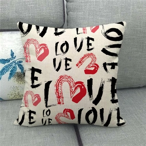 Detailed texture of linen throw pillow cover featuring LOVE text and red heart graphic
