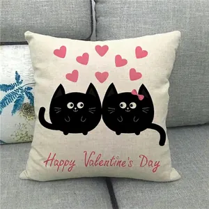 Close-up of linen pillow cover with cute black cats and Happy Valentine's Day text