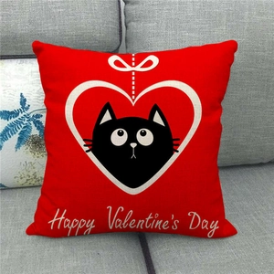 Close-up of red linen Valentine's Day pillow cover with cat and heart design