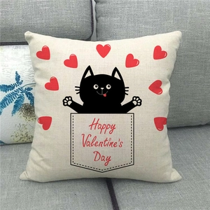 Detailed view of linen Valentine's Day pillowcase with cat and heart on sofa