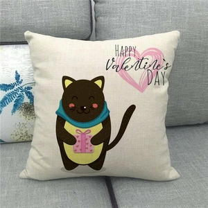 Detail of linen pillowcase featuring a cute cartoon cat with a pink heart gift box