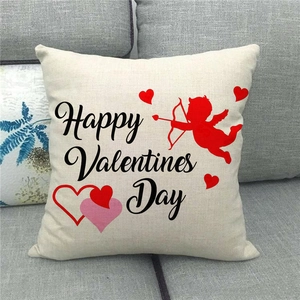 Detail of linen pillowcase with Happy Valentine's Day print on a gray sofa