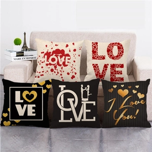 5-piece set of Valentine's Day linen pillow covers with LOVE heart patterns on sofa
