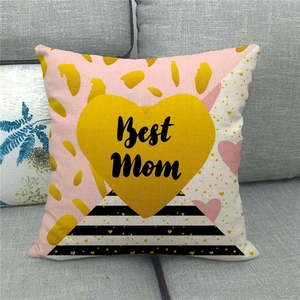 Linen blend square pillow cover featuring Best Mom golden heart on modern grey sofa