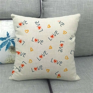 Close-up of heart and LOVE patterns on the linen pillowcase fabric texture