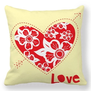 Detail of peach skin pillowcase with a red floral heart pattern and Love lettering