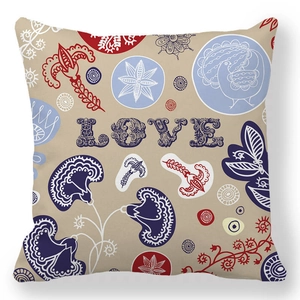 Detailed close-up of peach skin pillowcase with LOVE lettering and folk floral patterns