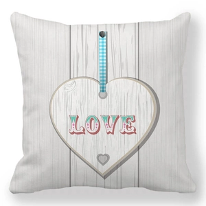 Detail of peach skin pillowcase with LOVE print and faux wood grain texture for home decor